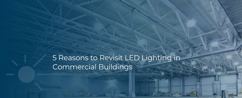 Header image of a warehouse ceiling with a gradient, navy color overlaid. Header text shows "5 Reasons to Revisit LED Lighting in 
Commercial Buildings" 
